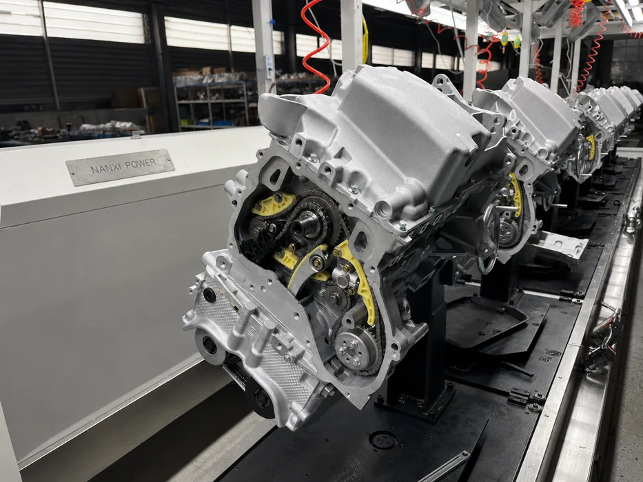 Automotive engine assembly on a production fixture inside a NANXI POWER factory area